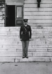 [A soldier is standing on the Professional Service Schools' steps]