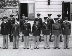 [Faculty standing in front of some members of the class of 1939]