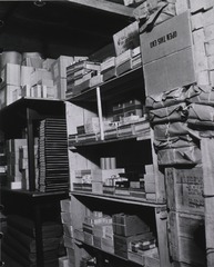USN Medical Supply Storehouse NO. 3: Salvaged wire-bound boxes, reinforced and used for shelving for classes 11 & 12 items