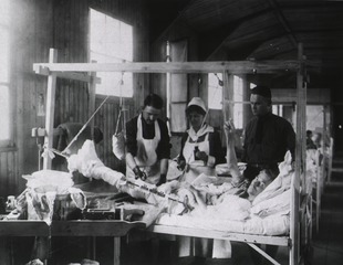 U. S. Army Base Hospital Number 52, Rimaucourt, France: Dressing a wounded soldier's leg
