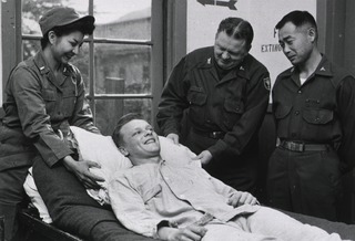 U.S. Army Evacuation Hospital No.21, Pusan, Korea: Patient receives personal attention as 100,000th to be admitted