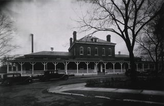 U.S. Army Post Hospital, Fort Thomas, Kentucky: Shows front view of two hospital wings used as wards, second and third floor of main building