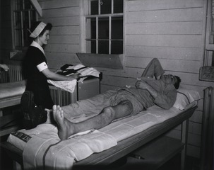 U.S. Army, La Garde General Hospital, New Orleans, Louisiana: Physical therapist preparing to massage a patient