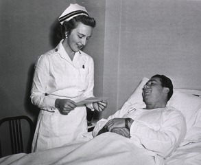 U.S. National Naval Medical Center, Bethesda, MD: Nurse reads letter to patient