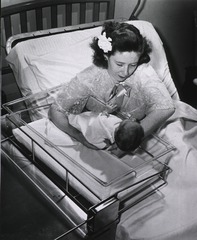 George Washington University Hospital, Washington, D.C: Interior view- Maternity Ward with crib attached to mother's bed