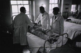U.S. Marine Hospital, Baltimore, Maryland: Doctors examine patient during rounds