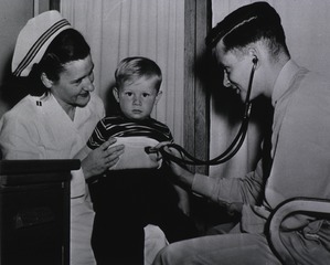 U.S. Naval Hospital, Quantico, VA: Doctor and nurse check a child patient