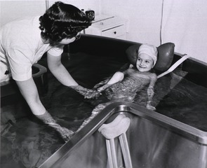 [Poliomyelitis patient in Hubbard Tub]