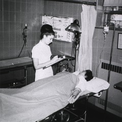 West Hudson Hospital, Kearny, N.J: Interior view- Emergency Room with nurse and patient