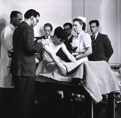 Middlesex Hospital, London, England: Physical examination of patient as interns watch