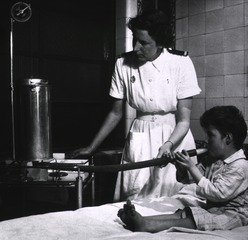 Middlesex Hospital, London, England: Nurse testing a child's vital capacity