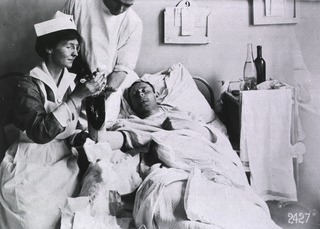 U.S. American National Red Cross Hospital No.1, Paris, France: Wounded soldier being attended to by nurse