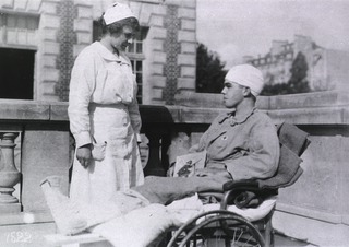 U.S. American National Red Cross Hospital No.1, Paris, France: Nurse tending to an American patient