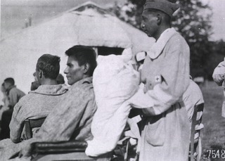 U.S. American National Red Cross Hospital No. 5, Auteuil, France: Two full-blooded Choctaw braves wounded on the field of battle outside of tent