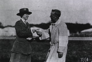 U.S. American National Red Cross Hospital No. 5, Auteuil, France: ARC worker offering a patient some gum