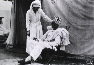 U.S. American National Red Cross Hospital No. 5, Auteuil, France: Nurse and convalescent soldier outside of the tents