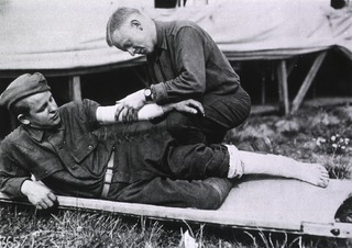 U.S. American National Red Cross Hospital No. 5, Auteuil, France: Soldiers demonstrating the use of bandages