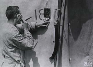 U.S. American National Red Cross Hospital No. 5, Auteuil, France: A convalescent soldier shaving outside of one of the hospital tents