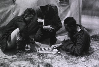 U.S. American National Red Cross Hospital No. 5, Auteuil, France: Red Cross man watching two patients playing checkers