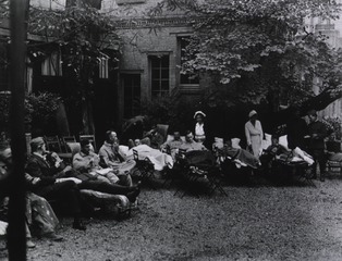 U.S. American National Red Cross Hospital No.3, Paris, France: Courtyard view showing wounded officers attended by nurses