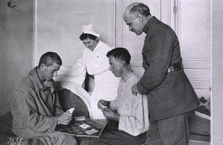 U.S. American National Red Cross Hospital No. 101, Paris, France: Doctor and nurse watch convalescent patients playing cards