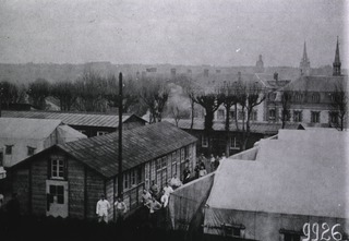 U.S. American National Red Cross Hospital No. 109, Évreaux, France: Rear view showing additional tents and barracks with main buildings in background
