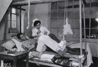 U.S. American National Red Cross Hospital No. 109, Évreaux, France: Nurse using Carroll-Dankin solution on patients wound - the antiseptic wash invented during the war greatly reduces mortality from wounds