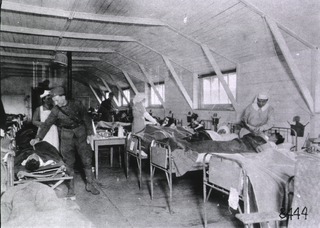 U.S. American National Red Cross Evacuation Hospital No. 114, Fleury-sur-Aisne, France: Ward M, nurses attending patients