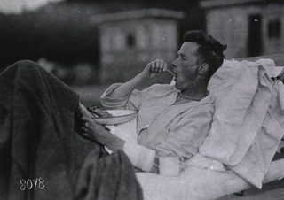 U.S. American National Red Cross Hospital No.5, Paris, France: Wounded soldier enjoying lunch at the Tent Hospital at Auteuil Race Track
