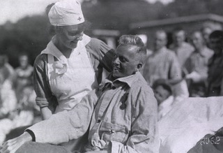 U.S. American National Red Cross Hospital No.5, Paris, France: Wounded soldier with nurse at the Tent Hospital at Auteuil Race Track