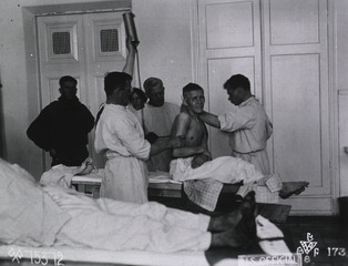 U.S. American National Red Cross Hospital, Tumen, Russia: Doctors and 16 year old Russian soldier in operating room