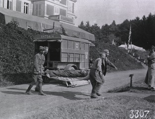 U.S. American National Red Cross Hospital, Jouy-le Chatel, France: Carrying wounded on stretchers after German air raid