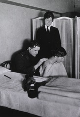 U.S. American National Red Cross Tuberculosis Hospital, St. Eugenie, France: Doctor examining a woman for traces of tuberculosis