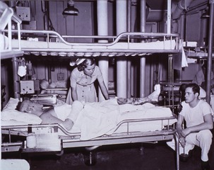 USS Consolation (US Navy Hospital Ship): Nurse adjusting patients position