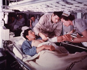 USS Haven (US Navy Hospital Ship): Patient attended to by a Doctor and Nurse