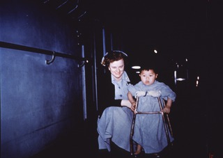 USS Haven (US Navy Hospital Ship): Nurse with child patient