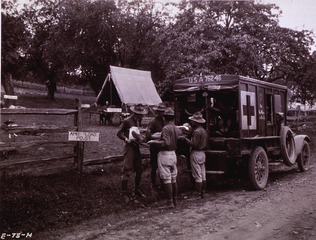 Ambulances: View of ambulance loaded with wounded (WWI era)