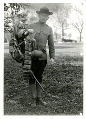 Medicine - Military - Equipment: View of soldier holding his pack and belt