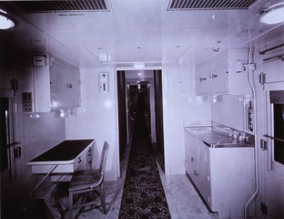 Hospital Trains: Interior view- U.S. Army Medical Department Hospital Unit Car, looking down corridor from Pharmacy