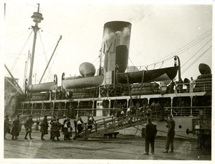 Transportation of wounded and sick: Loading wounded soldiers onto S.S. Maui at embarkation port at Bassen, France for return to the United States