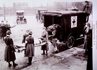 U.S. American National Red Cross: Nurses loading patient onto ambulance at Base Hospital No. 1