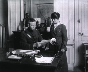[Lt. Col. Daniel D. Card, Chief Purchasing Officer, with Mabel Knarr, Civilian Employee]