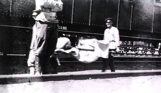 [Loading a hospital train with typhoid victims, Station 83, Manchuria]