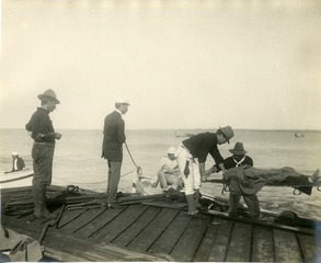 [Loading sick in boats for transfer to H.S. Relief at Arroya, Puerto Rico]