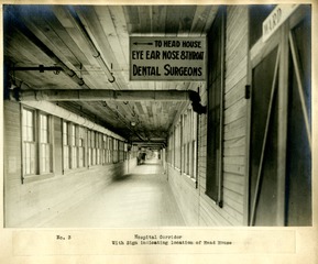 [Hospital corridor with sign indicating location of Head House]