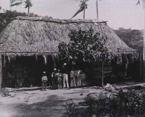 Native Hut, with typical family group of Cubans of Santiago Province