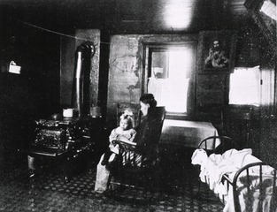 [A woman in a rocking chair with a child]
