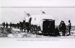 [Ambulances - Horse-drawn: British ambulance taking in the Boer wounded on the field during the War in South Africa, 1899-1902]