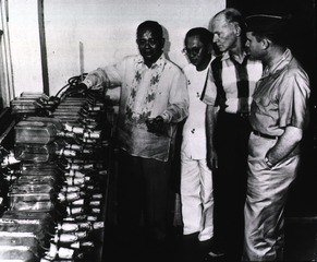 Officials check the initial shipment ... of vaccine