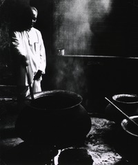 Dr. A. Subasingha, of Galle, Sri Lanka, as well as being a prominent practisying ayurvedic doctor, is a manufacturer of ayurvedic herbal medicines. Here he is stirring the massive pure copper pots in which the medicines are prepared